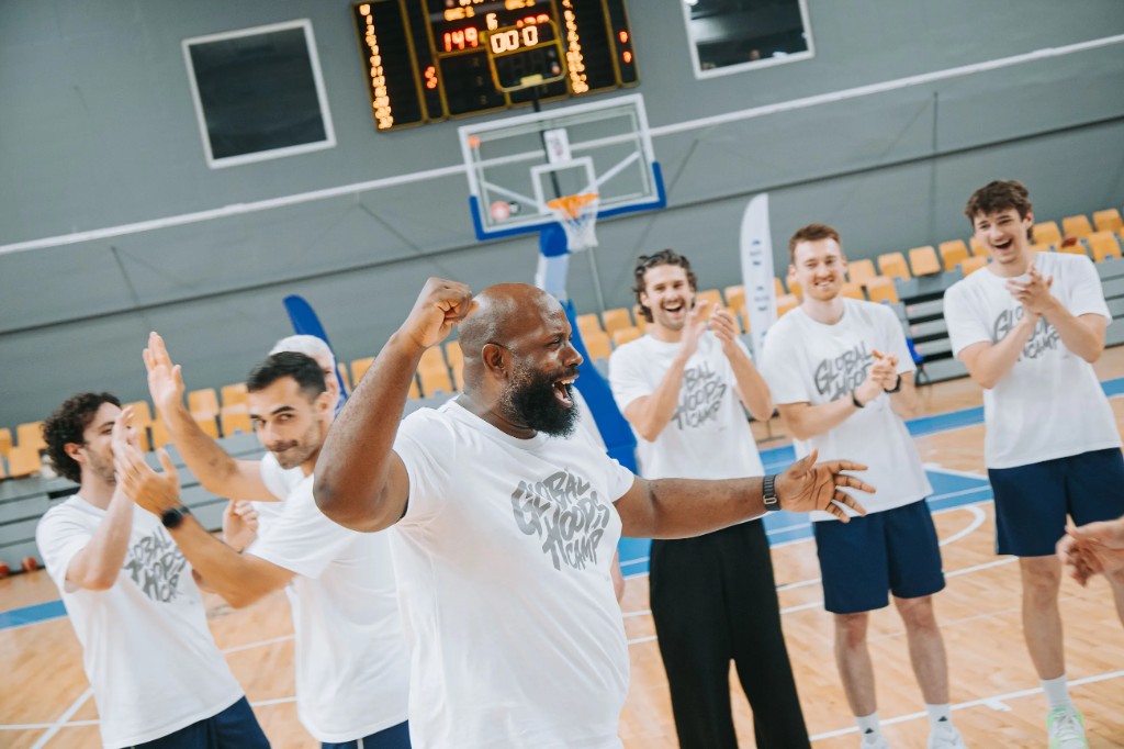 Coaches celebrating on the court at Global Hoops Camp