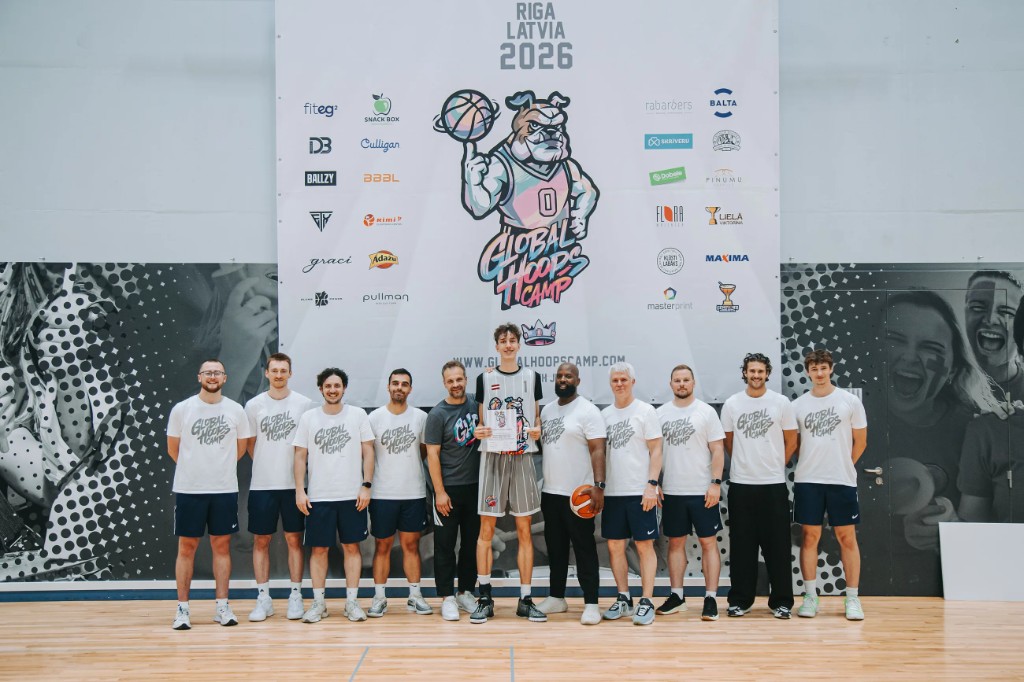 Coaching staff and a player on the Global Hoops Camp 2026 stage